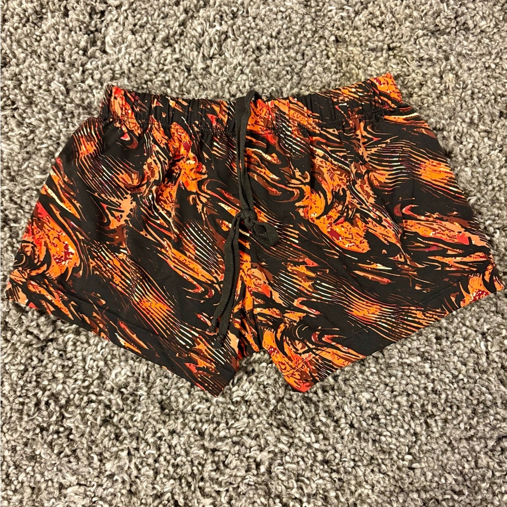 Amazon Athletic Orange and Black Shorts with Flame Pattern
